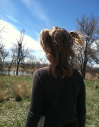 Girl standing by lake
